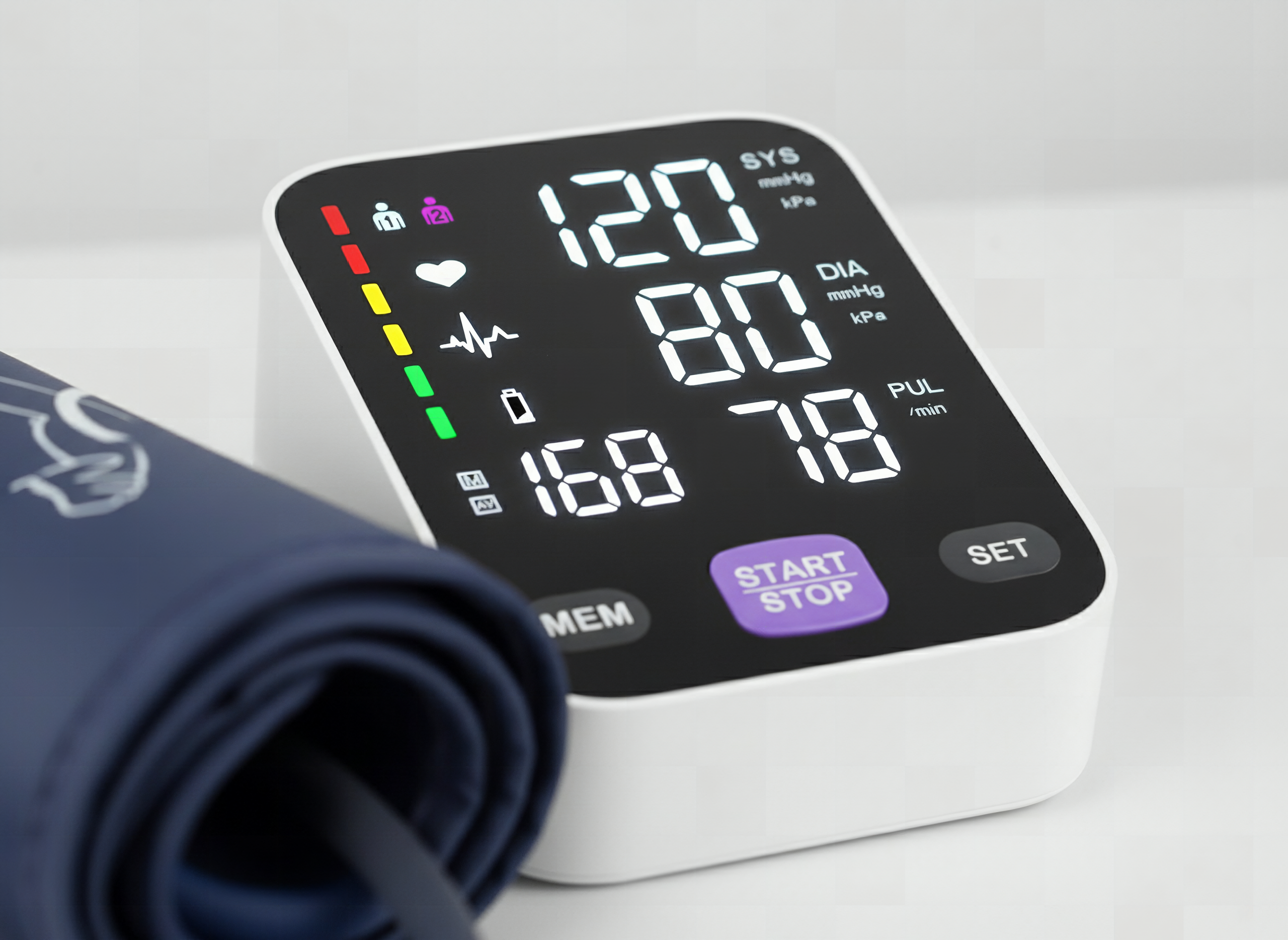 Close-up of upper arm BP monitor display and buttons showing clear digital readout