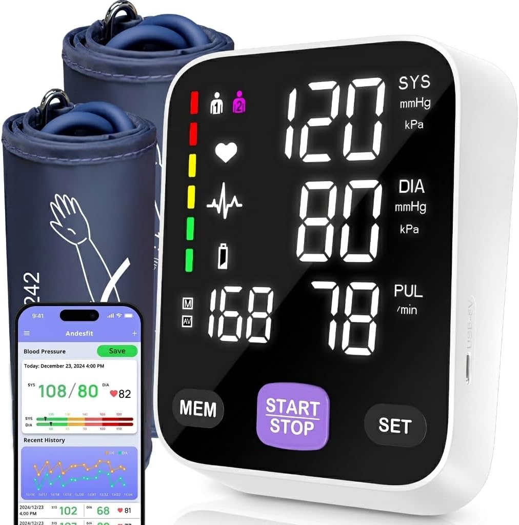 Overhead flat-lay of BP monitor with extra-large cuff, smartphone, and USB cable on gray surface