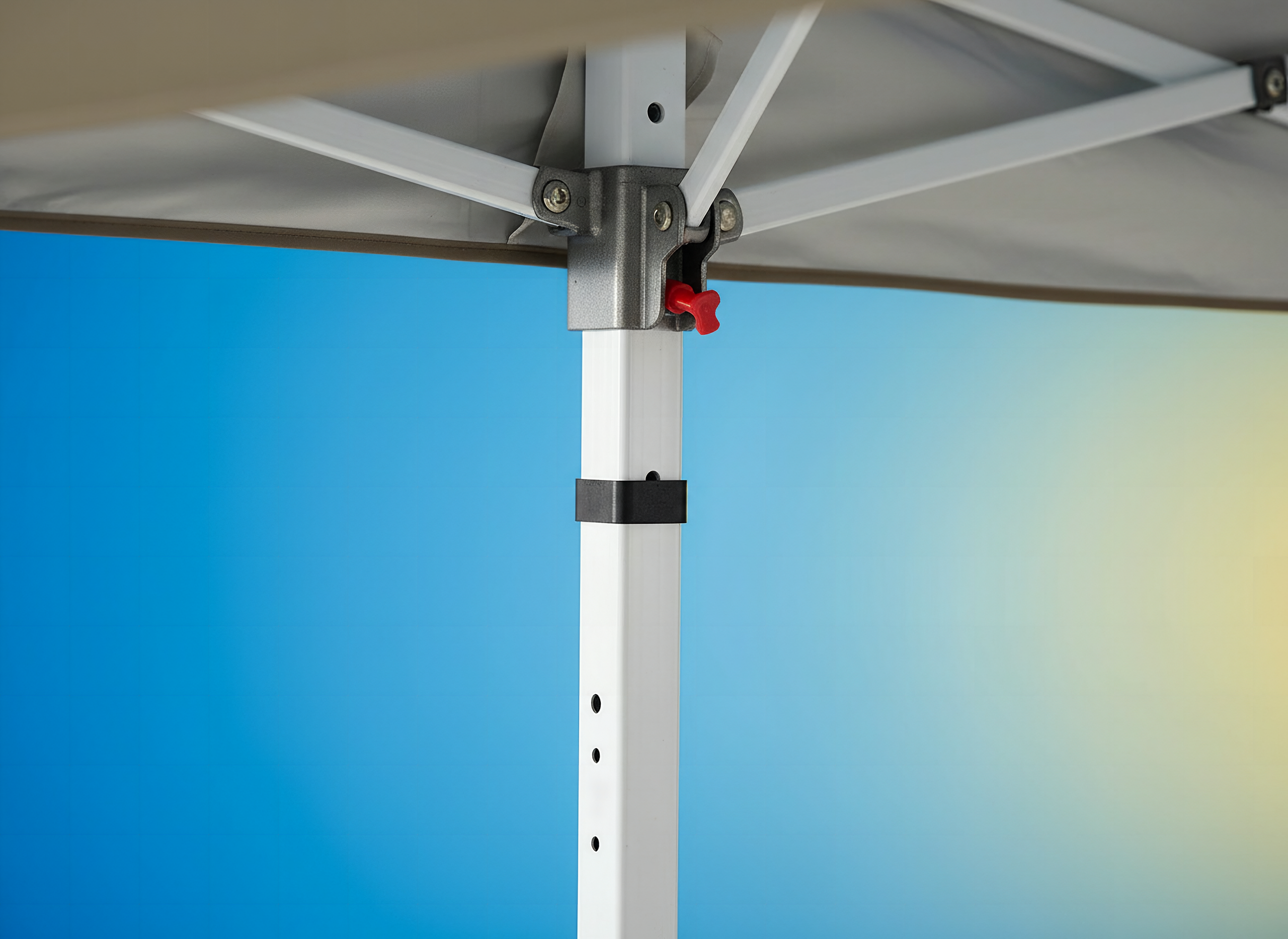 Macro detail of the Garvee pop-up canopy's reinforced metal corner joint and leg lock mechanism