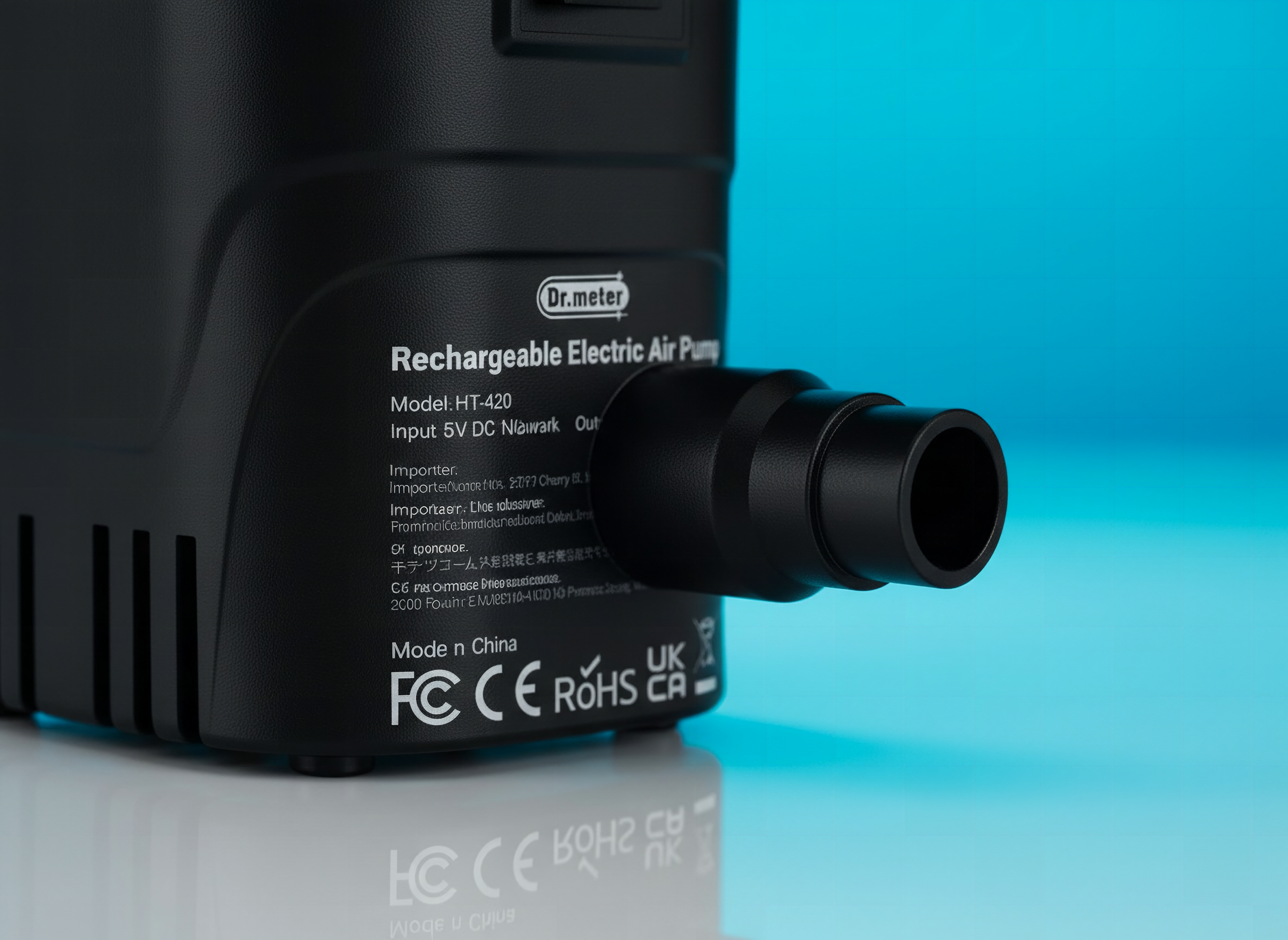 Close-up of Dr.meter air pump showing nozzle and valve connections with shallow focus