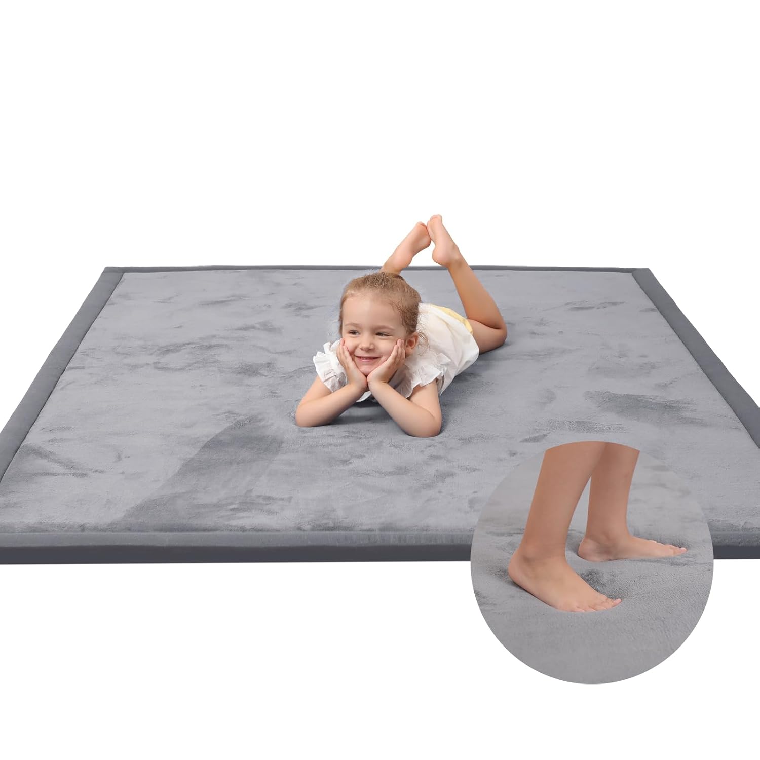 Macro detail of Huloo Sleep Baby Play Mat dark gray velvet surface with visible memory foam texture