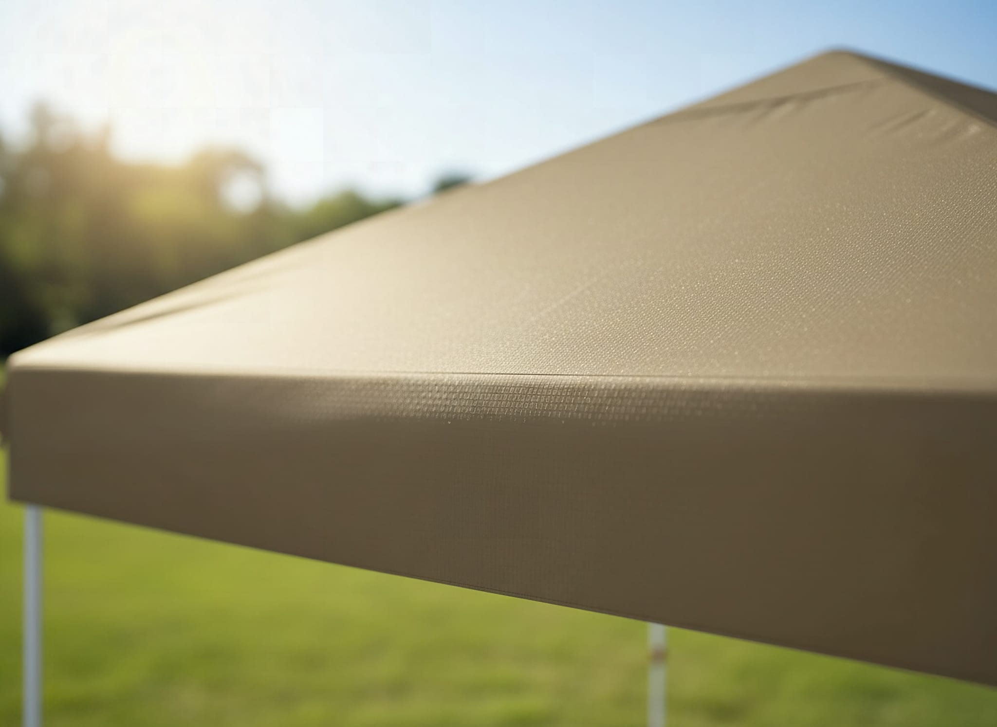 Macro detail of Garvee pop-up canopy fabric weave showing waterproof coating texture in bright sunlight